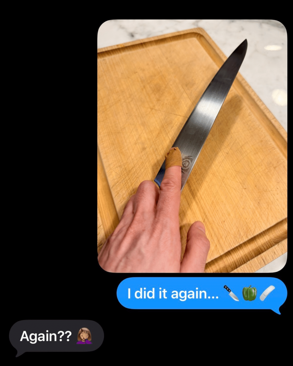 Hand holding a sharp knife above a wooden cutting board.